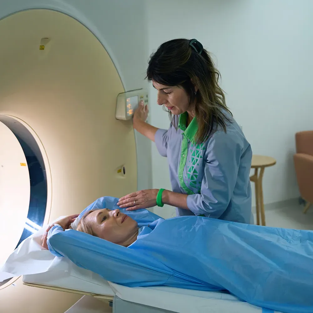 Rad tech guiding patient through X-ray procedure